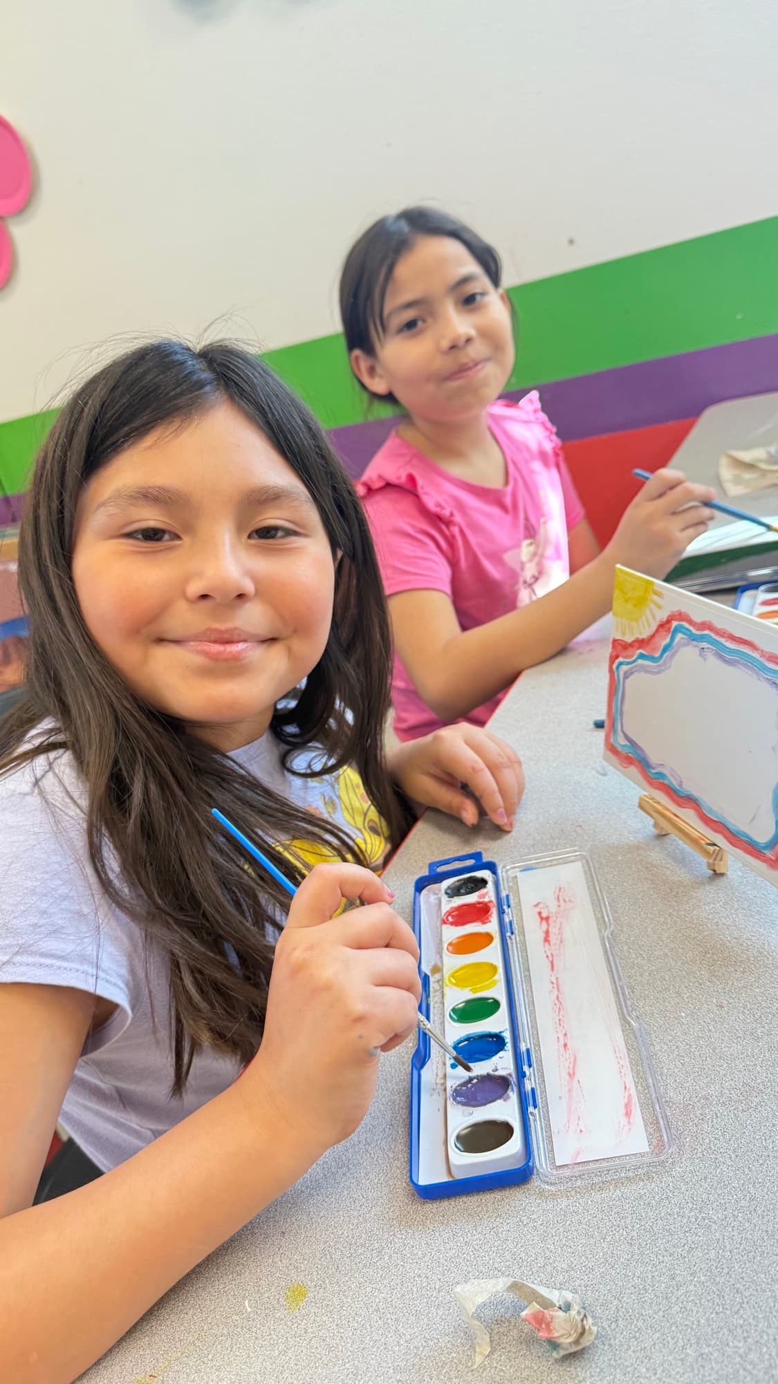 Two Club members painting with watercolors during an arts and crafts activity at the Boys & Girls Club of Pharr–San Juan